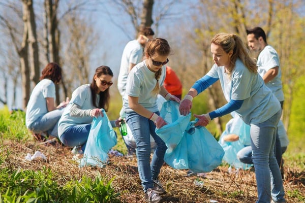 Volunteers picking up trash along Shearon Harris Road for cycling 